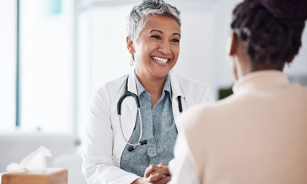 woman helping another womN